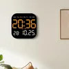 A digital clock mounted on a wall. Produktbild-Vorschau