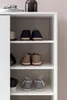 A white shoe cabinet with multiple shelves filled with shoes. Náhled obrázku produktu