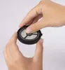 Hands holding a reusable coffee filter. Produktbild-Vorschau