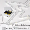 A close-up view of a battery-powered LED light string, likely for Christmas decoration, with the battery pack and text indicating specifications. Produktbild-Vorschau