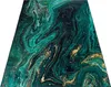 A rectangular rug with a marbled pattern in shades of green and gold, laid flat on a white background. Náhled obrázku produktu