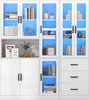 A white display cabinet with blue LED lighting, filled with books, decorative items, and framed pictures. Podgląd zdjęcia produktu