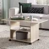 A living room scene with a couch, coffee table, and rug. Produktbild-Vorschau