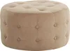 A round, tufted ottoman is shown against a white background.
