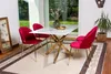 A dining table with chairs in a well-lit room with a large window overlooking a garden. Anteprima dell’immagine prodotto