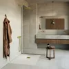 A modern bathroom with a shower, vanity, and accessories. Produktbild-Vorschau