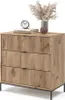 A wooden dresser with three drawers, a clock, books, and a vase with dried flowers on top. Produktbild-Vorschau