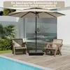 A patio umbrella and chairs are set up next to a swimming pool on a wooden deck. Podgląd zdjęcia produktu