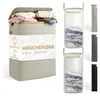 A product image showcasing a beige laundry basket with a wooden lid, filled with clothes. Several other laundry baskets in different colors are displayed to the right. Podgląd zdjęcia produktu