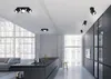 A modern kitchen and living area with multiple ceiling lights. Anteprima dell’immagine prodotto
