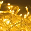 A close-up shot of many warm white LED lights on transparent wires. Anteprima dell’immagine prodotto