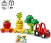 A LEGO DUPLO toy set featuring a tractor and vegetable-themed train cars, with a small figure holding a seed packet. Produktbild-Vorschau