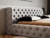 A close-up view of a tufted upholstered bed frame and headboard. Náhľad obrázku produktu