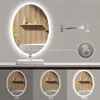 A vanity mirror with LED lighting is shown, with different brightness levels illustrated below. Náhled obrázku produktu