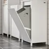 A white laundry cabinet with a grey fabric hamper inside, the cabinet door is open and angled outwards. Produktbild-Vorschau