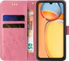 A pink floral flip phone case with card slots and a euro banknote is shown open, revealing a smartphone screen. Produktbild-Vorschau