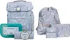 A school backpack set with a lunchbox and pencil case, all featuring a blue and white whale and feather pattern. Náhled obrázku produktu