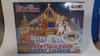 A Christmas circus scene with characters and animals, on the front of an advent calendar. Anteprima dell’immagine prodotto