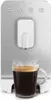 A coffee machine dispensing coffee into a glass mug. Voir les images du produit