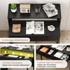 A black desk with various items on it, including a computer, books, and office supplies. The image is divided into sections highlighting different features of the desk. Náhled obrázku produktu