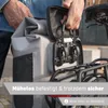A person is attaching a waterproof bicycle bag to a rear rack on a bicycle. Produktbild-Vorschau