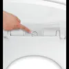 A finger is pressing a button on a toilet seat hinge. Anteprima dell’immagine prodotto