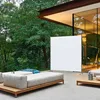 An outdoor living space with modern furniture and a large screen. Produktbild-Vorschau