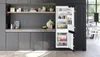 A modern kitchen interior with an open refrigerator. Produktbild-Vorschau