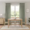 A dining set with a table and chairs in a room with curtains and a window. Produktbild-Vorschau