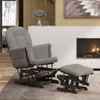 A gray fabric glider chair and ottoman are placed in a living room setting with a fireplace and artwork on the wall. Produktbild-Vorschau