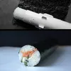 A split image showing a sushi maker in use and a finished sushi roll. Náhled obrázku produktu
