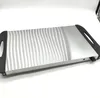 A silver buffet food warmer with black handles on a white background. Voir les images du produit