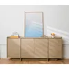 A wooden sideboard with a mirror and decorative items on top, set against a white wall. Produktbild-Vorschau