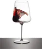 A wine glass with red wine splashing inside, isolated on a white background. Produktbild-Vorschau