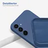 A close-up view of a blue phone case, highlighting the camera cutout and the interior texture. The case is shown at an angle, resting on a white surface. Produktbild-Vorschau
