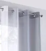 Close-up of two sheer curtains hanging on a curtain rod. Produktbild-Vorschau