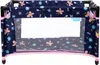 A doll's travel crib with a floral and butterfly pattern. Produktbild-Vorschau