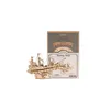 A 3D wooden puzzle of a sailing ship is displayed next to its packaging. Produktbild-Vorschau