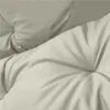 A close-up view of a tufted cushion, likely for outdoor furniture. Náhled obrázku produktu
