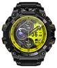 A close-up, front-facing view of a black and yellow smartwatch with a detailed digital display. Podgląd zdjęcia produktu