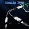 A USB-C to 3.5mm audio and charging adapter is shown with a smartphone and charging cable. Produktbild-Vorschau