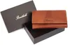 A brown leather wallet is presented in its open gift box against a white background. Produktbild-Vorschau