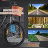 A close-up of an electric bicycle's front wheel and handlebars, with additional marketing images of roads and forests on the right side. Produktbild-Vorschau