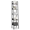 A tall, narrow ladder shelf unit with decorative items on display. Produktbild-Vorschau