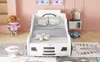 A child's bed designed to look like a car, in a bedroom setting with decorative items. Anteprima dell’immagine prodotto
