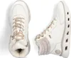 A pair of white winter boots with beige laces and fur lining, shown from a top-down and side view. Voir les images du produit