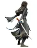 A vinyl figurine of a female character holding a sword, viewed from the side. Náhled obrázku produktu
