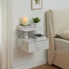 A wall-mounted nightstand with a marble-like finish is shown next to a bed. Náhľad obrázku produktu