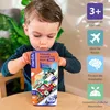 A young child is playing with a magnetic train box on a table. Produktbild-Vorschau