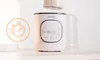 A baby bottle warmer is shown on a white surface with a stopwatch icon overlay. Anteprima dell’immagine prodotto